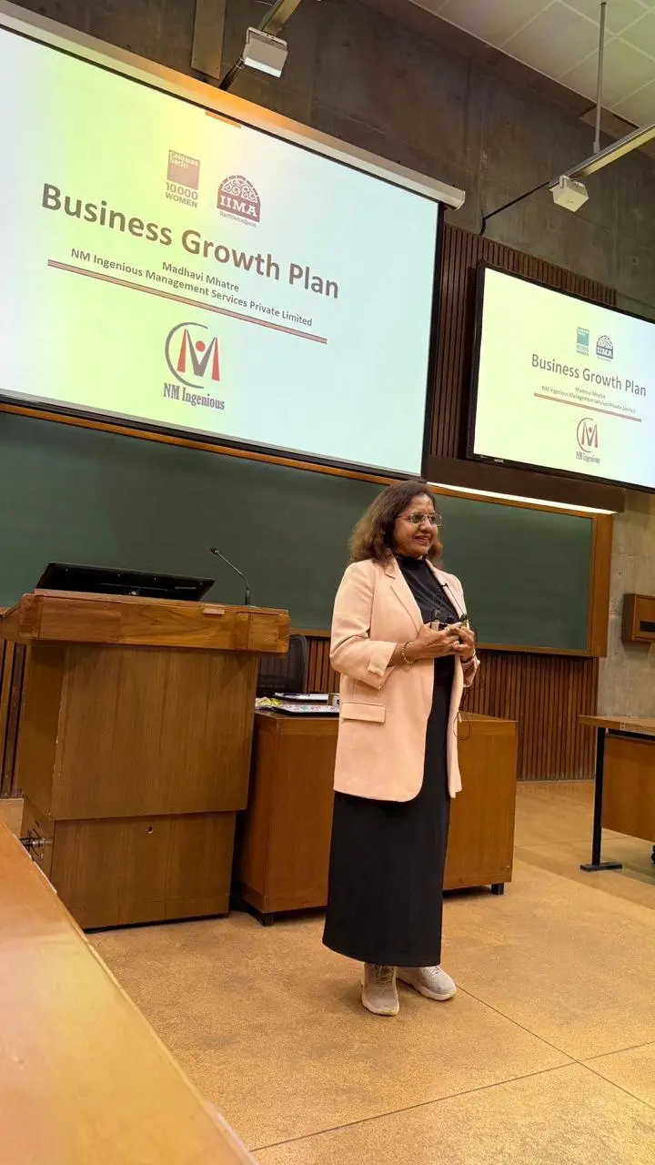 NM Ingenious leadership addressing an audience at a company event